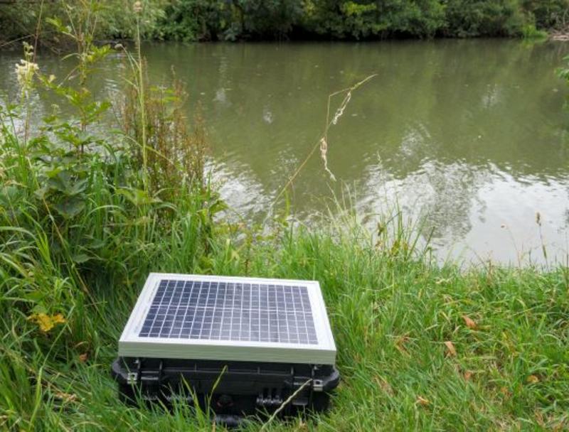 photograph of a solar powered sensor system for measuring water pollution in rivers
