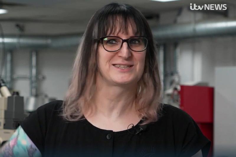 Dr Barker in her lab, smiling