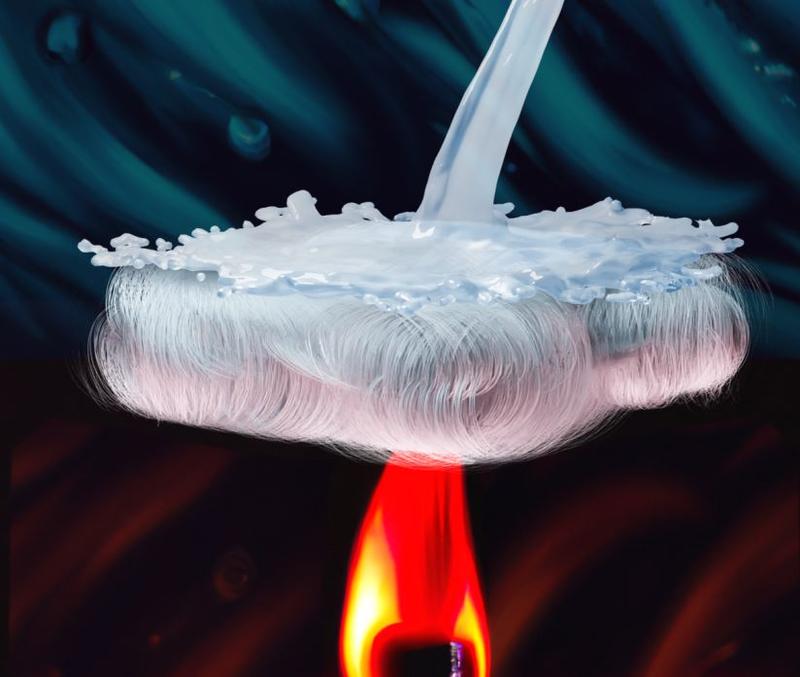 the fibre suspended above a flame and repelling liquid from above, simultaneously demonstrating fireproof and waterproof qualities