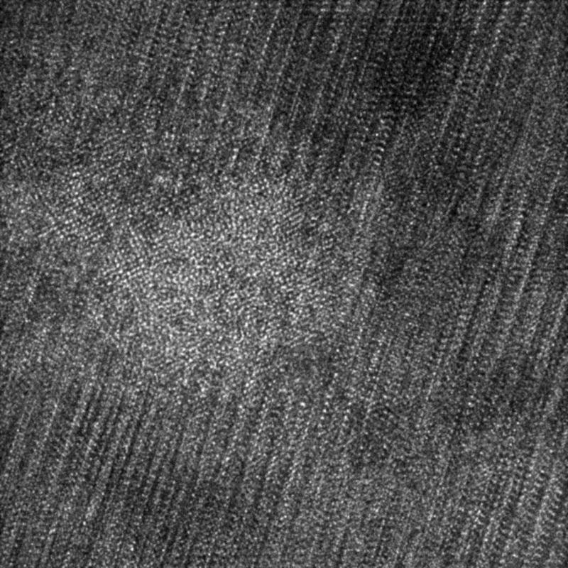 High resolution transmission electron microscope image of collision cascade damage in a high temperature superconductor from high energy neutrons